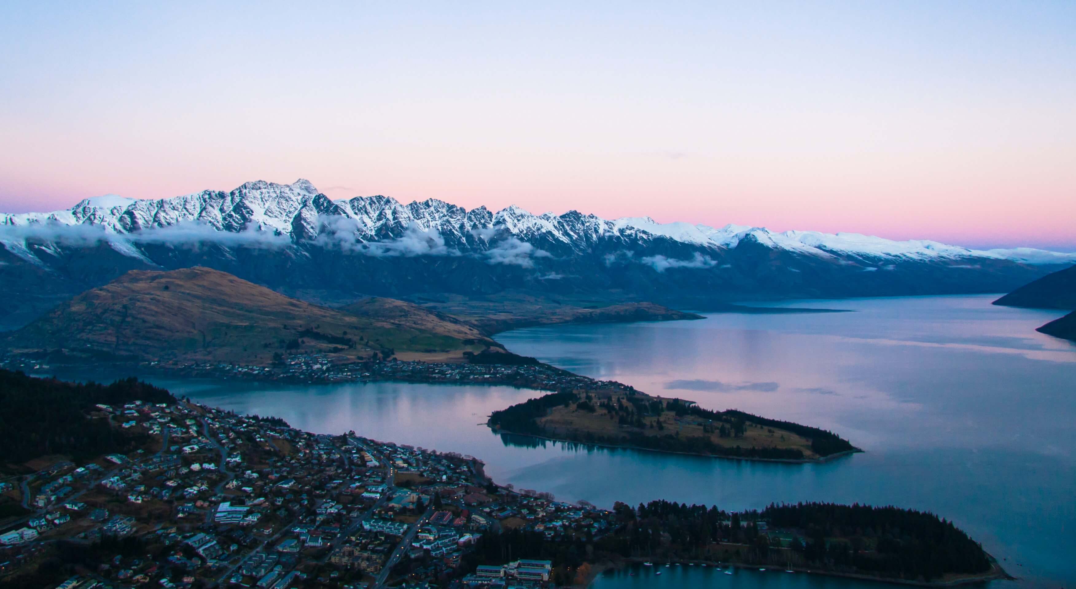 Image of Queenstown city at sunset with mountains and lake