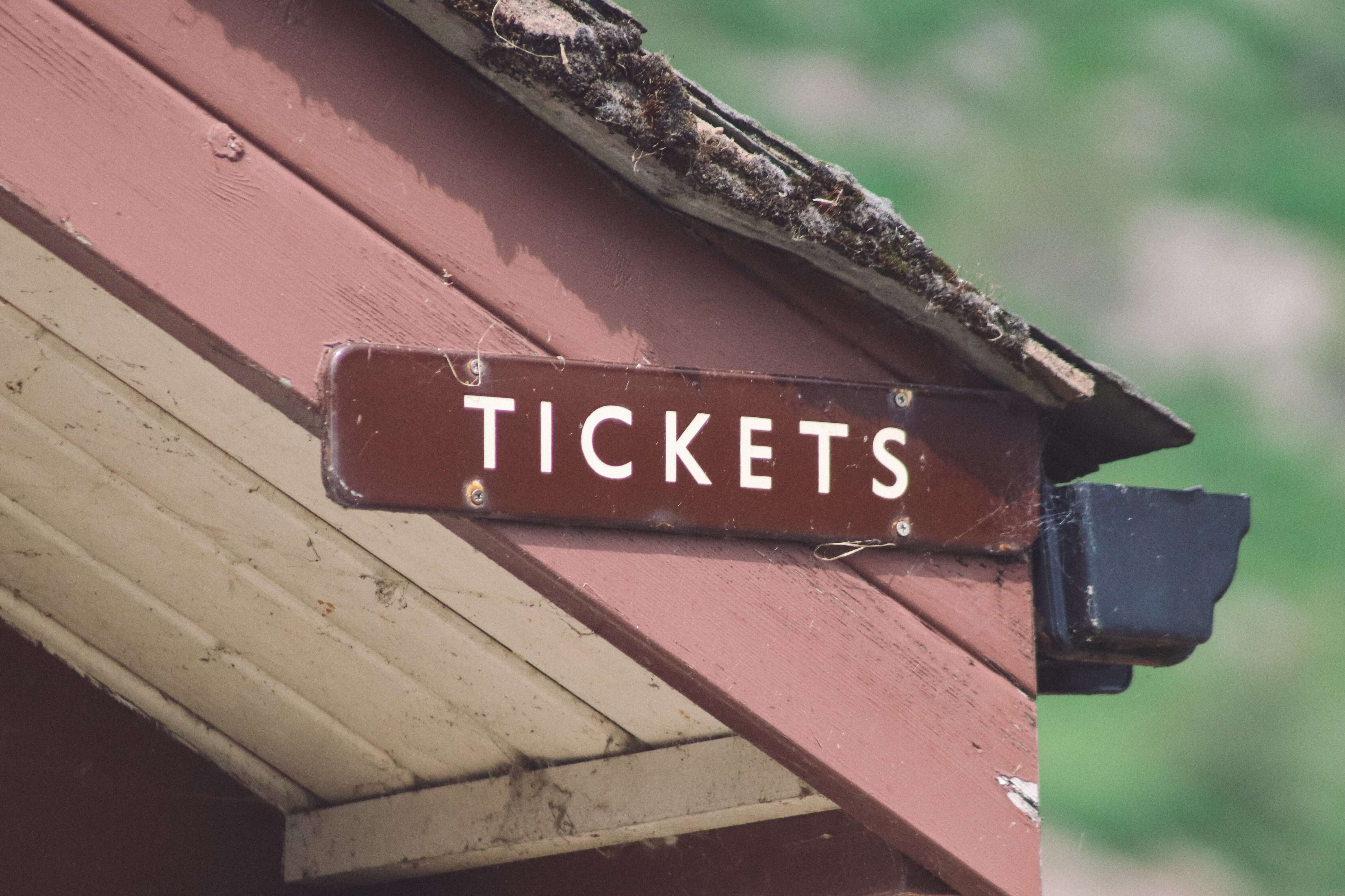 A sign informing that tickets are for sale in this building